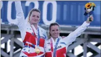  ??  ?? Team GB sailors Eilidh Mcintyre and Hannah Mills celebrate after winning Olympic sailing gold yesterday in Tokyo