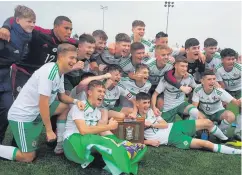 ??  ?? Glory boys: Northern Ireland Schoolboys celebrate their Victory Shield triumph after overcoming Wales yesterday