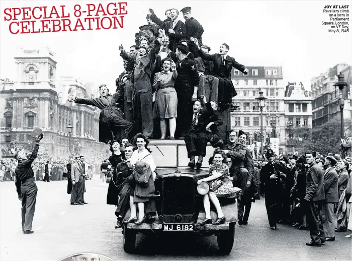  ??  ?? JOY AT LAST
Revellers climb on a lorry in Parliament Square, London, on VE Day, May 8, 1945