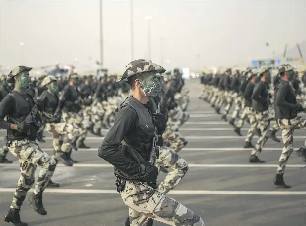  ?? MOSA’AB ELSHAMY / THE ASSOCIATED PRESS ?? Saudi security forces take part in a military parade in 2015.