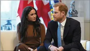  ??  ?? Le couple lors d’une visite à la Maison du Canada, à Londres, le 7 janvier.
