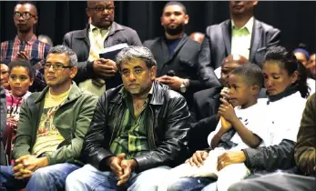  ??  ?? Cosatu provincial secretary general Tony Ehrenreich, Imraahn Mukaddam and Courtney Pieters’s mother, Juanita, with Courtney’s brother, Adrian, during the memorial service for the 3-year-old.