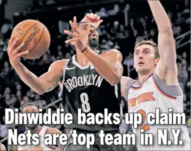  ?? AP ?? AT THEIR EX-SPENCE: Spencer Dinwiddie, who scored a team-high 19 points, drives to the basket during the Nets’ 113-107 win over the Knicks on Friday at Madison Square Garden.