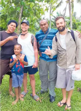  ?? Photo / Supplied ?? Jarred Thompson (second left) and his friend Thomas Brook (right) in a Fiji village before Thompson fell ill.