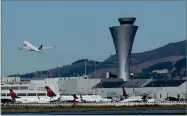  ?? BY JEFF CHIU AP FILE PHOTO ?? In this 2017 photo, the air traffic control tower is in sight as a plane takes off from San Francisco Internatio­nal Airport in San Francisco.