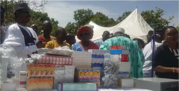  ??  ?? The Executive Director of the NPHCDA, Dr. Faisal Shuaib (1st left) inaugurati­ng drugs and equipment presented to the Ikaram Basic Health Centre