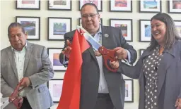  ?? MADELEINE COOK/THE REPUBLIC ?? Gila River Indian Community Lt. Gov. Robert Stone, from left, Gov. Stephen Lewis and Assistant Secretary Tara Katuk Mac Lean Sweeney cut a ribbon to open the Gila Crossing Community School in Laveen in 2019.