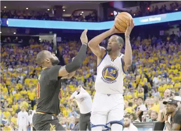  ?? — USA Today Sports ?? Golden State Warriors forward Kevin Durant (35) shoots over Cleveland Cavaliers forward LeBron James (23) during the second half in game two of the 2017 NBA Finals at Oracle Arena.