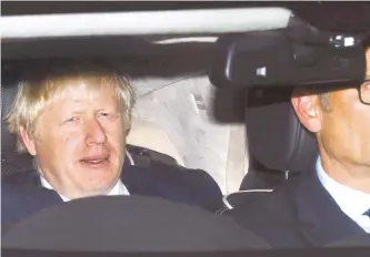  ?? Reuters-Yonhap ?? Britain’s Prime Minister Boris Johnson leaves the Houses of Parliament by car in London, Monday. British MPs rejected a second attempt by Johnson to call an early election to break the Brexit deadlock, in a final show of defiance before he controvers­ially suspends parliament.