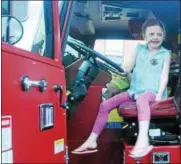  ?? DIGITAL FIRST MEDIA FILE PHOTO ?? Kaeleigh Miller looks over a Phoenixvil­le Fire Company No. 1 truck at the borough’s National Night Out observance.