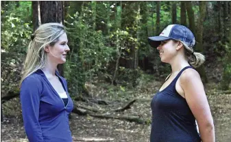  ?? PHOTO COURTESY OF SOUND MIND SOUND BODY THERAPY ?? Camilla Coakley, left, owner of Sound Mind Sound Body Therapy, in an outdoor therapy session with a client.