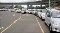  ?? SUPPLIED ?? REGISTERED metered taxis queue outside the King Shaka Internatio­nal Airport. |