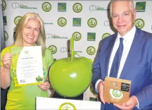  ??  ?? Dr Paula Owen presents the Green World Ambassador award to Graham Hammond, a trustee of the KM Charity Team