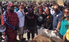  ?? NORB FRANZ — THE MACOMB DAILY ?? Macomb County Executive Mark Hackel (second from left) is shown at a protest.