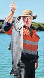  ?? PHOTO: GERARD O’BRIEN ?? Tipping the scales . . . Dunedin angler Lyall Nash displays an 8kg (18 pound) salmon caught near Port Chalmers on Saturday.