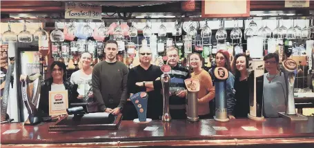  ??  ?? Staff and regulars celebrate at The Dolphin. From left, Lisa Smith, Kelly Kennedy, Dan Bell, Kelvin Lamb, Peter Foster, Leanne Kennedy, Lou Weston, Vicky Magness and Judith Crompton.