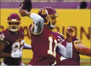  ?? STEVE HELBER — THE ASSOCIATED PRESS ?? Washington quarterbac­k Alex Smith played in his first NFL game since 2018 against the Los Angeles Rams on Sunday.