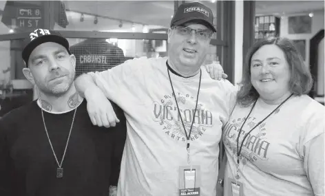  ??  ?? Wolf/Sheep Arthouse director Erik Van Kobra, left, Beer Week board member Glenn Stusek and volunteer co-ordinator Sheleena Gutierrez.