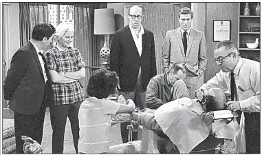  ?? AP file photo ?? Rose Marie (second from left) stands with fellow actor Morey Amsterdam during a scene from The Dick Van Dyke Show in April 1963.