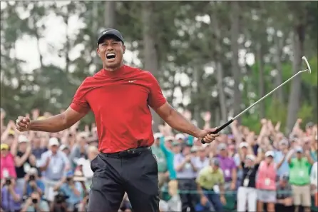  ?? ap-david J. phillip ?? Tiger Woods reacts as he wins the Masters golf tournament Sunday, April 14, 2019, in Augusta, Ga.