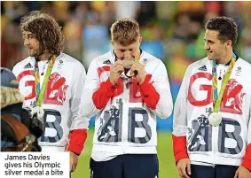  ?? ?? James Davies gives his Olympic silver medal a bite