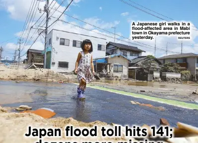  ?? REUTERS ?? A Japanese girl walks in a flood-affected area in Mabi town in Okayama prefecture yesterday.