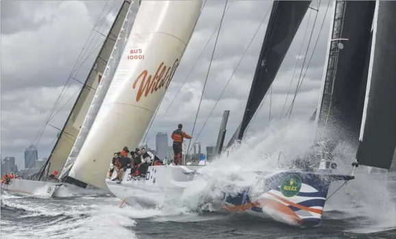  ?? Picture: ANDREA FRANCOLINI ?? Action in the ocean as Giacomo and Wild Oats XI battle it out during the CYC trophy on Sydney Harbour