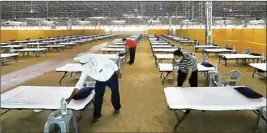  ?? PTI ?? Workers give final touches to the makeshift of 10,000-bed COVID-19 facility being prepared at Radha Soami Satsang Beas grounds on Friday