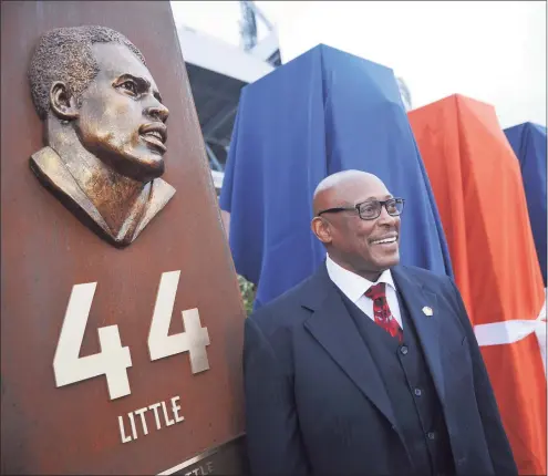  ?? Hyoung Chang / Denver Post via Getty Images ?? Pro football Hall of Fame running back Floyd Little unveiled the sculpture at the Denver Broncos Ring of Fame Plaza in Sports Authority Field at Mile High in Denver in 2013.