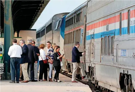  ?? [PHOTO BY PAUL HELLSTERN, THE OKLAHOMAN] ?? Transporta­tion and city officials board an Amtrak train in Oklahoma City for a test run to Kansas City to help determine the feasibilit­y of adding new rail service to the north.