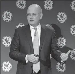  ?? [ELI KABILLIO/GENERAL ELECTRIC VIA AP] ?? General Electric Chairman and CEO John Flannery addresses investors at a meeting in New York on Monday.