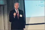  ?? Luther Turmelle / Hearst Connecticu­t Media ?? John Traynor, chief investment officer for Bridgeport-based People’s United Bank, delivers his economic outlook for 2022 on Thursday to members of the Greater New Haven Chamber of Commerce.