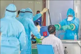  ??  ?? ■
Medics take samples at the Chennai airport on Sunday.