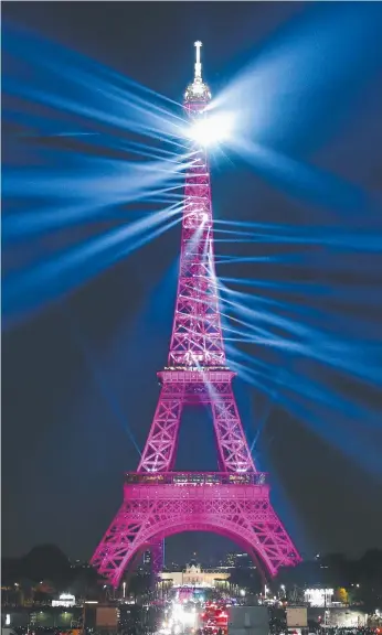  ?? Picture: AP ?? WOW FACTOR: A laser light show illuminate­s the Eiffel Tower for its 130th anniversar­y.