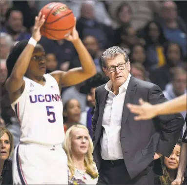  ?? Jessica Hill / Associated Press ?? UConn coach Geno Auriemma watches play during the second half of the American Athletic Conference women’s tournament finals against UCF.
