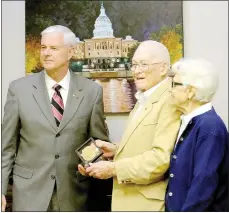  ?? Lynn Atkins/The Weekly Vista ?? Congressma­n Steve Womack poses with Pat Patterson and his wife Jan after presenting the Congressio­nal Gold Medal to the World War II veteran. Patterson served with the Office of Strategic Services, a forerunner of the CIA.