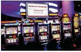  ?? GREG LYNCH / STAFF ?? Digital billboards inside Miami Valley Gaming urge gamblers to Please Play Responsibl­y.