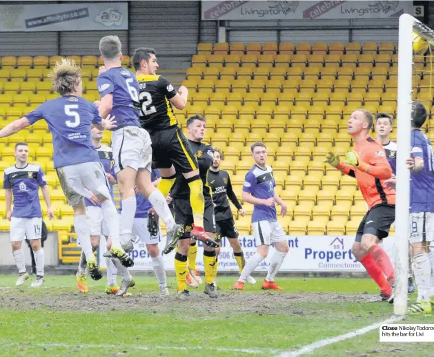  ??  ?? Close Nikolay Todorov hits the bar for Livi