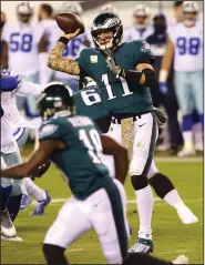  ?? (AP/Rich Schultz) ?? Philadelph­ia quarterbac­k Carson Wentz (11) has led the Eagles to the top of the NFC East standings despite the team’s 3-5-1 record. Wentz’s 12 intercepti­ons lead the NFL.