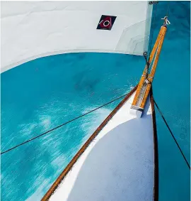  ??  ?? Below: Polynesian celebratio­ns for Te Maru O Havaiki’s launch day. Right: the main hull’s prow cuts through azure Pacific waters