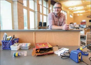  ?? ERIC BONZAR — THE MORNING JOURNAL ?? Brian Kokai, Elyria City School District director of technology operations, discusses the relocated ImaginEeri­ng Hub at the high school July 25. The program, which formally utilized a transforme­d art classroom, quickly outgrew its space, Kokai said....