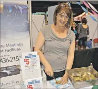  ?? DESIREE ANSTEY/ JOURNAL PIONEER ?? One of the 75 participan­ts at the CUP event, Catherine Arsenault, of the Silver Fox Entertainm­ent Complex, was handing out fresh local Malpeque oysters to shuck.