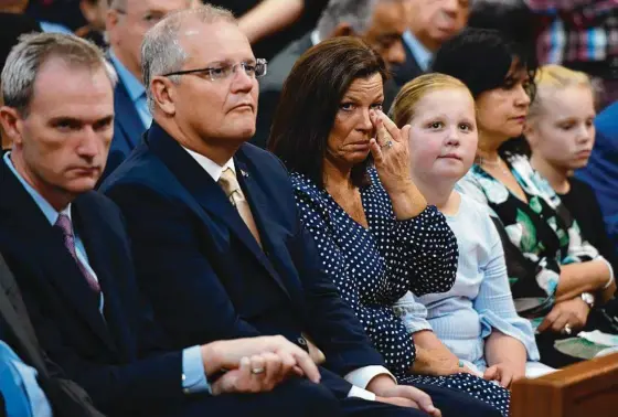  ?? Picture: AAP IMAGE ?? Immigratio­n Minister David Coleman, Prime Minister Scott Morrison and wife Jenny Morrison at St Mark Coptic Orthodox Church yesterday