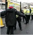  ??  ?? Cracking down...police stop and search youngsters in Liverpool