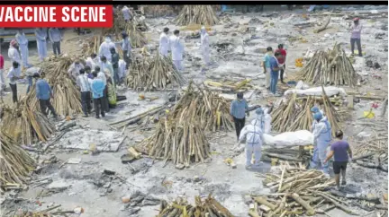  ?? (Photo: AFP) ?? NEW DELHI, India — Family members and relatives prepare the funeral pyre of victims who died of COVID-19, during mass cremation held at a crematoriu­m in New Delhi on April 27, 2021.