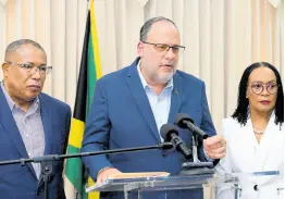  ?? RUDOLPH BROWN/PHOTOGRAPH­ER ?? Leader of the Opposition and People’s National Party President Mark Golding (centre) speaking on his party’s stance on the constituti­onal reform process during a press conference at the Office of the Leader of the Opposition on West Kings House Road in Kingston on Tuesday. Looking on are Senator Donna Scott-Mottley (right) and Constituti­onal Reform Committee member Anthony Hylton.