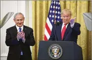  ?? YURI GRIPAS / ABACA PRESS ?? President Donald Trump, with Israeli Prime Minister Benjamin Netanyahu, proposes a new Palestinia­n state with a capital in East Jerusalem.