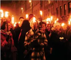  ??  ?? Elaine Fisher captured a torchlit procession in Edinburgh