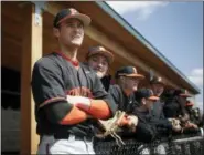  ?? SETH WENIG — THE ASSOCIATED PRESS ?? Princeton Tigers’ Jake Boone, left, looks over the field before their game against the Monmouth Hawks in Princeton, N.J., Thursday. Boone is trying to put himself in position to make his the first four-generation major league family. His...