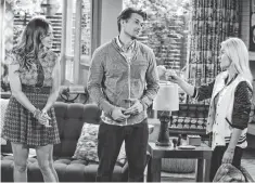  ?? ERIC MCCANDLESS, NBC ?? Prudence ( Kelly Brook), left, Luke ( Nick Zano) and Elisha Cuthbert ( Lizzy) are a modern Three’s Company with a twist.